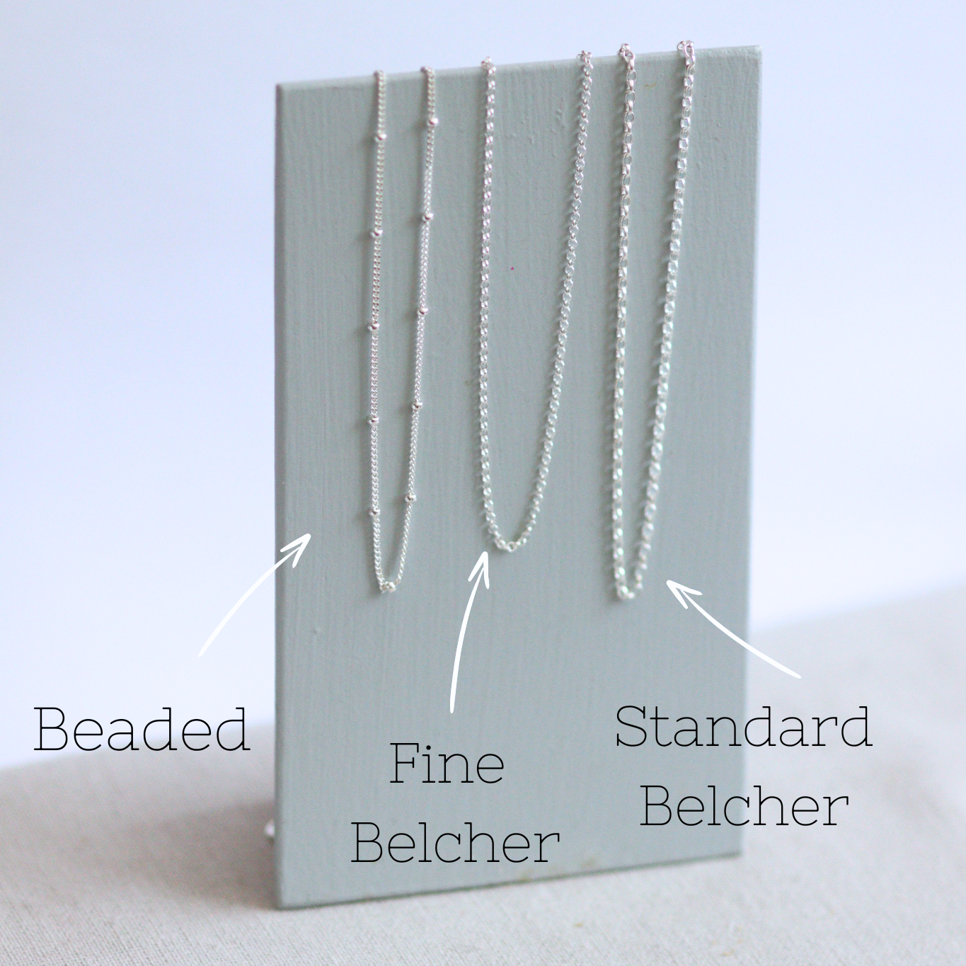 Sterling silver chains a beaded satellite chain, fine trace belcher and a standard belcher.