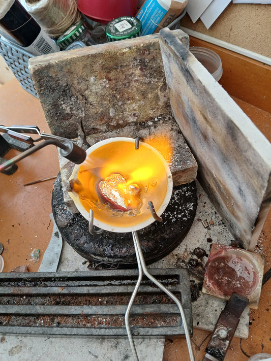 Melting sentimental gold in a crucible with a jewellers torch.
