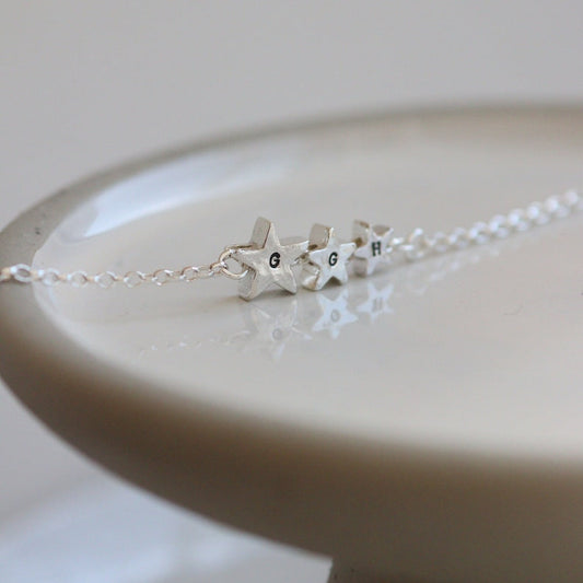 3 silver star beads with personalised initials on a fine silver chain