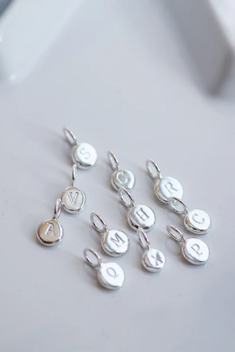 pebble pendants with initials imprinted