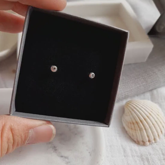 Silver personalised initial stud earrings in a grey jewellery box
