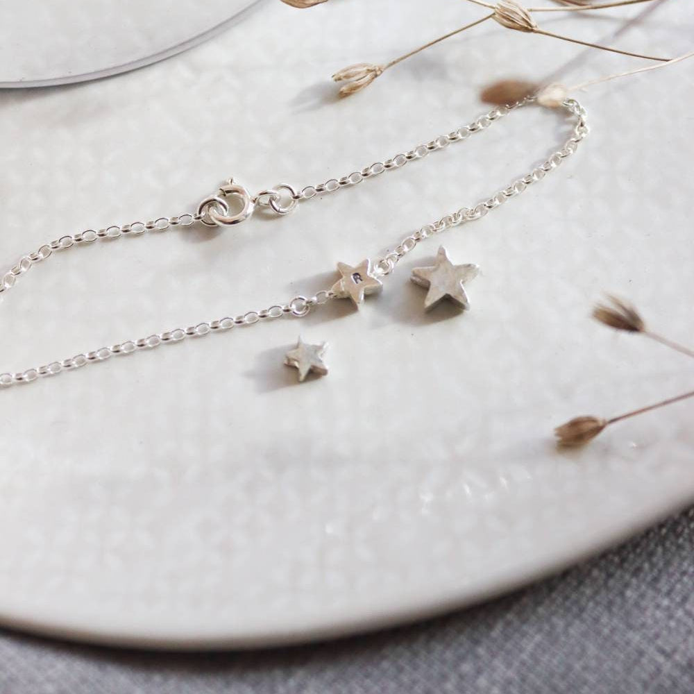 3 sizes of silver star bead including one already on a silver chain.