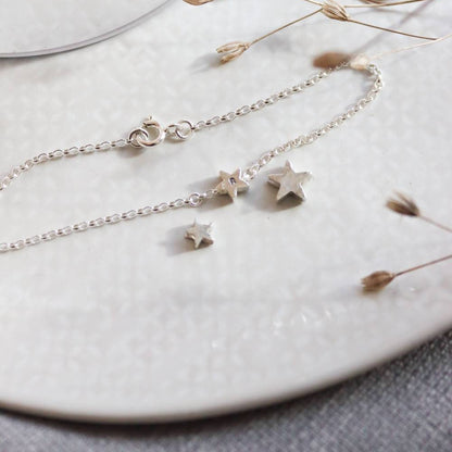 3 sizes of silver star bead including one already on a silver chain.